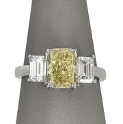 Fancy yellow diamond three stone ring