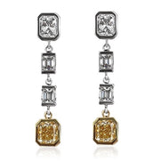 Two tone gold diamond drop earrings featuring fancy yellow diamonds.