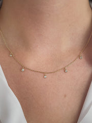 Floating diamond necklace shown on model.