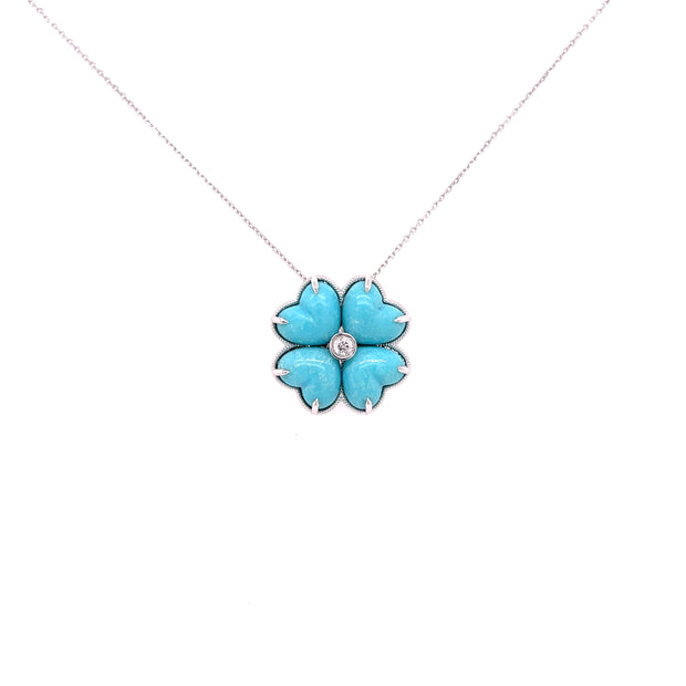 Four-leaf clover necklace featuring turquoise cabochons and round diamond in white gold
