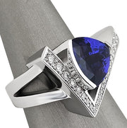 Side view of Tanzanite ring in white gold featuring graduated round diamonds