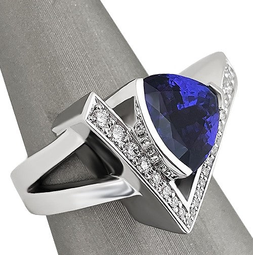 Side view of Tanzanite ring in white gold featuring graduated round diamonds