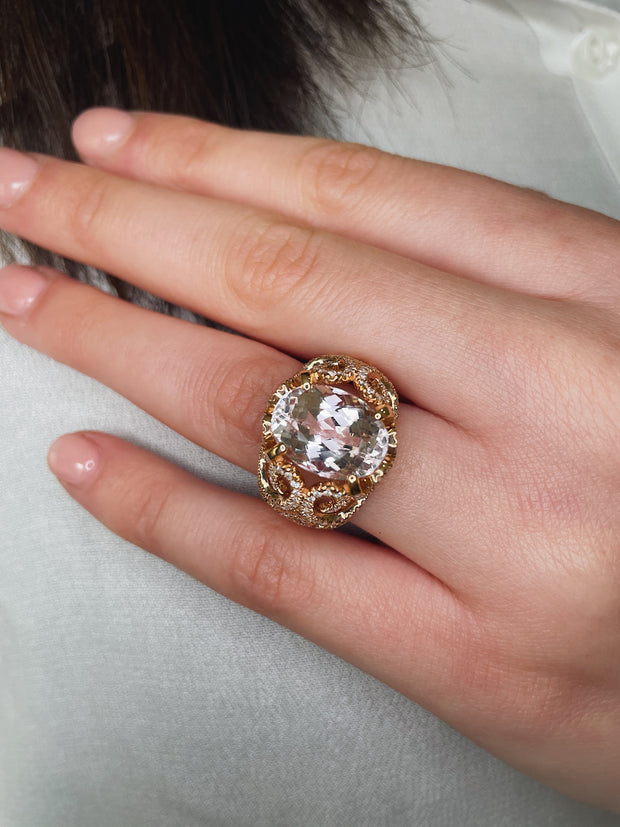 Rose gold ring with large Morganite center stone on model's hand