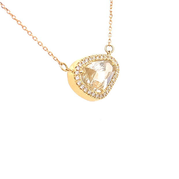 Natural sapphire slice with yellow hues and diamond halo on 18K gold chain