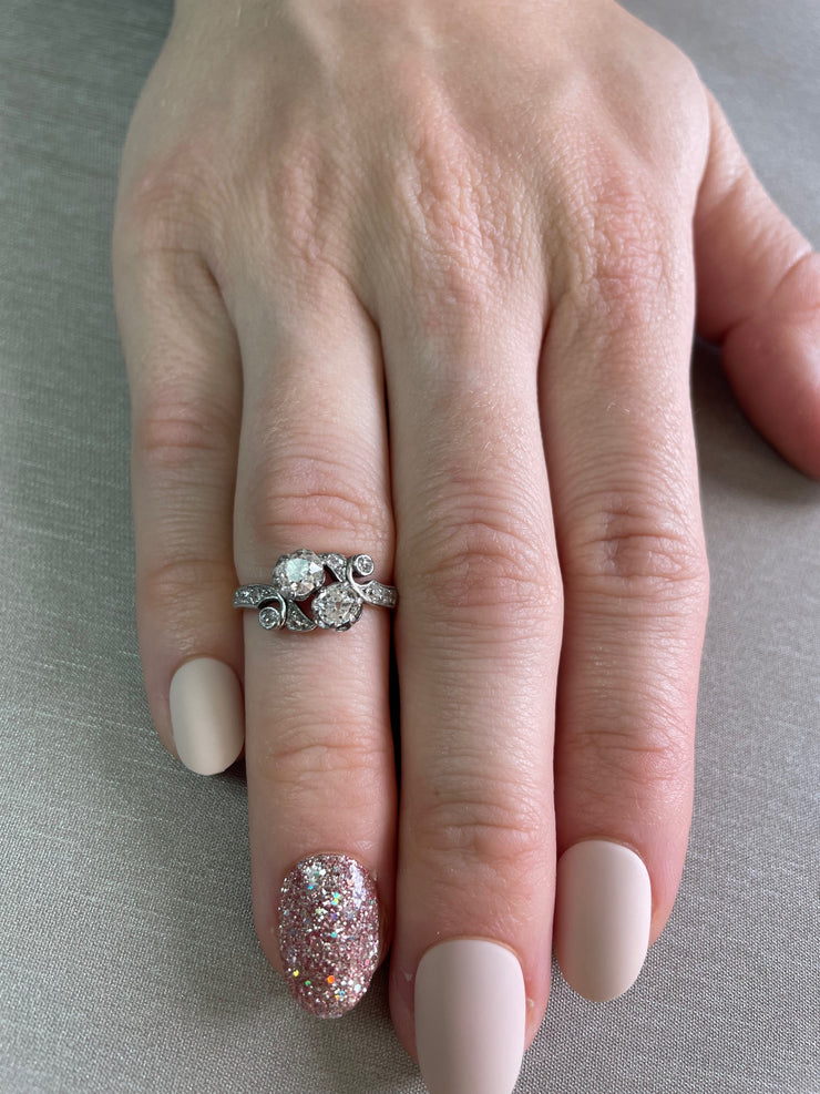 Timelessly romantic, this antique ring showcases the understated beauty of old rose cut diamonds, delicately set in a refined 14k white gold prong setting. 