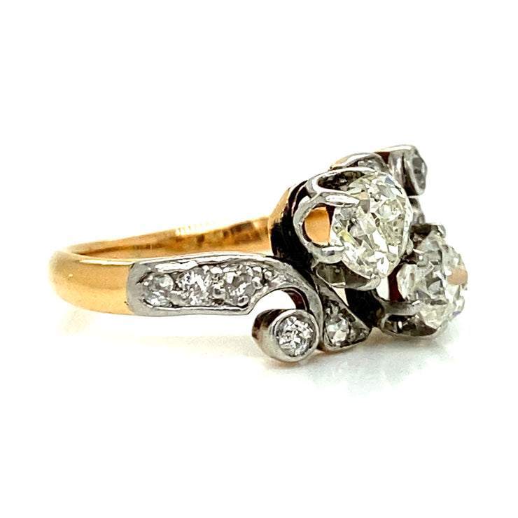 The warm contrast of the polished yellow gold band adds a touch of classic elegance, enhancing the vintage charm of this heirloom piece.