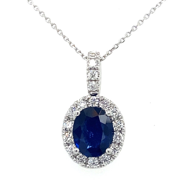 Oval sapphire and diamond halo pendant in 18k white gold with chain necklace
