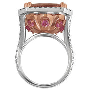 1.02 carats of pavé-set round brilliant diamonds in the halo and shoulders.