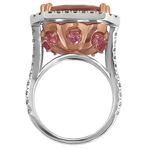 1.02 carats of pavé-set round brilliant diamonds in the halo and shoulders.