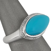 Set in 18K white gold to enhance the turquoise’s vivid tone.