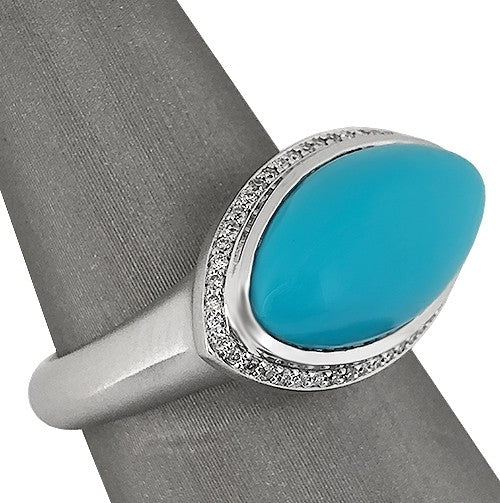 Set in 18K white gold to enhance the turquoise’s vivid tone.