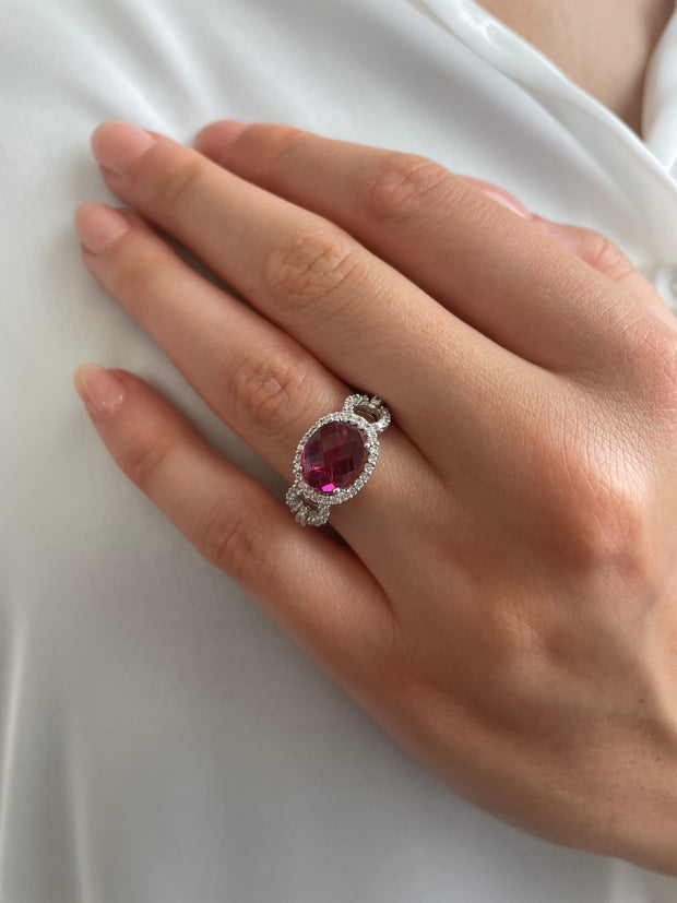 Elegant 2.48 carat tourmaline ring accented with 0.14 carats of round brilliant diamonds on model's hand
