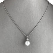 Beautifully balanced diamond and pearl pendant necklace.