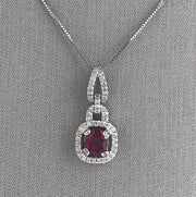 Ruby and diamond halo pendant