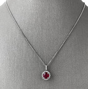 Vivid and romantic, this ruby and diamond halo pendant is a celebration of passion and timeless elegance.