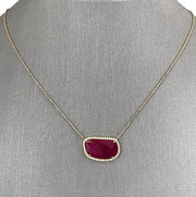 Vibrant Ruby Slice with natural diamond halo set in 18K yellow gold.