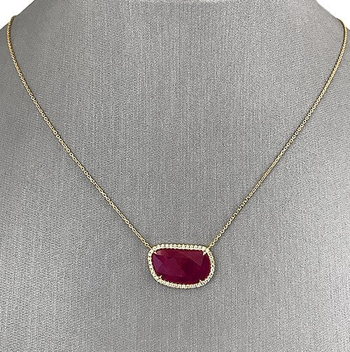 Vibrant Ruby Slice with natural diamond halo set in 18K yellow gold.
