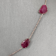 A closer look at the natural ruby slices set in rose gold.