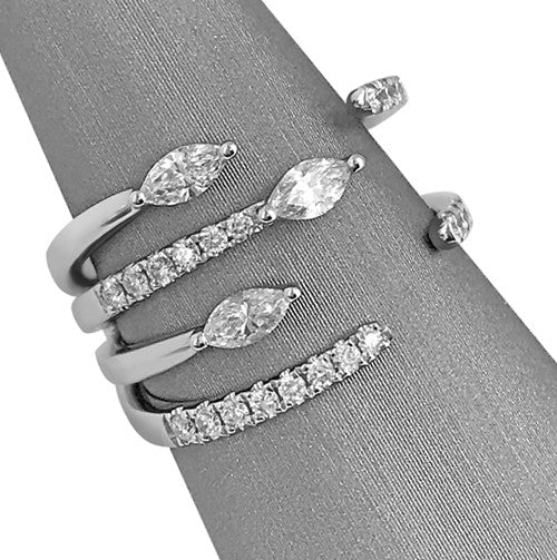 Set with 0.73 carats total weight of marquise and round brilliant cut diamonds.