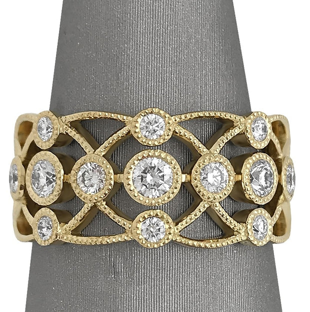 Bezel set diamonds and milgrain working throughout the ring.