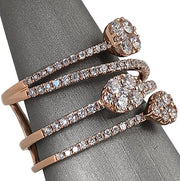 Viewed from the side, the elegant silhouette of this cocktail ring reveals its sculptural design and harmonious diamond arrangement. 