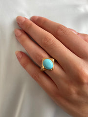 Sleeping Beauty turquoise ring worn on hand showing bold color and modern design