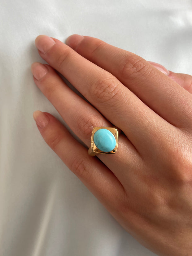 Sleeping Beauty turquoise ring worn on hand showing bold color and modern design