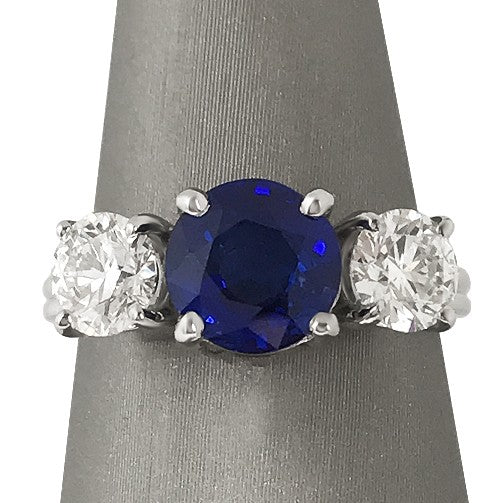 Blue Sapphire and diamond three stone ring