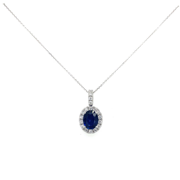 A close detailitn the brilliant blue sapphire center with sparkling diamond halo.