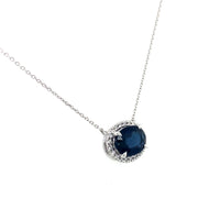 This stunning necklace features a 1.86 carat vibrant sapphire, gracefully framed by a halo of round brilliant cut diamond.