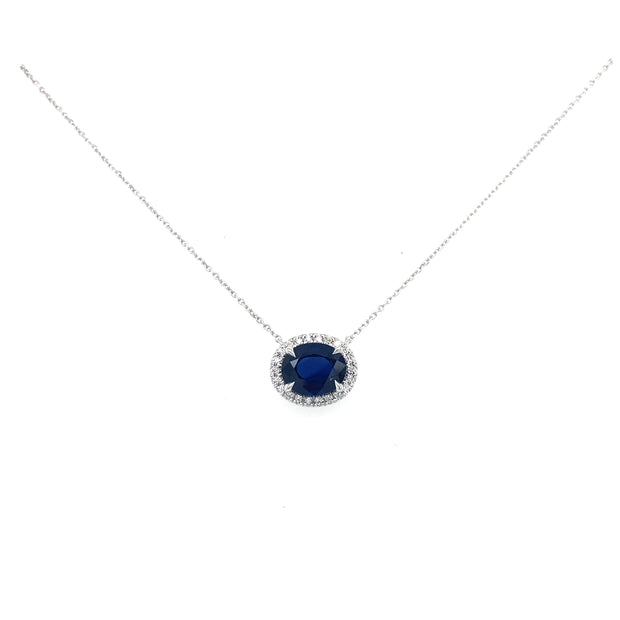 1.64 ct sapphire necklace with diamond halo and chain against a white background