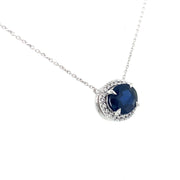 Modern sapphire and diamond pendant set in 18K white gold