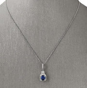 Elegant and enchanting, this sapphire halo pendant captures the allure of classic romance and refined craftsmanship.