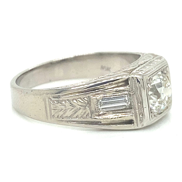 Side profile revealing the elegant 18K white gold setting, and accent baguette diamonds.