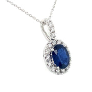 Close-up of 1.39 ct oval sapphire pendant with 0.38 ctw diamond halo and bail