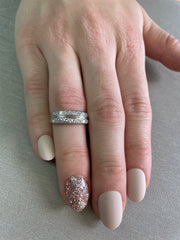 Worn on hand, either solo or stacked, showing its timeless versatility.