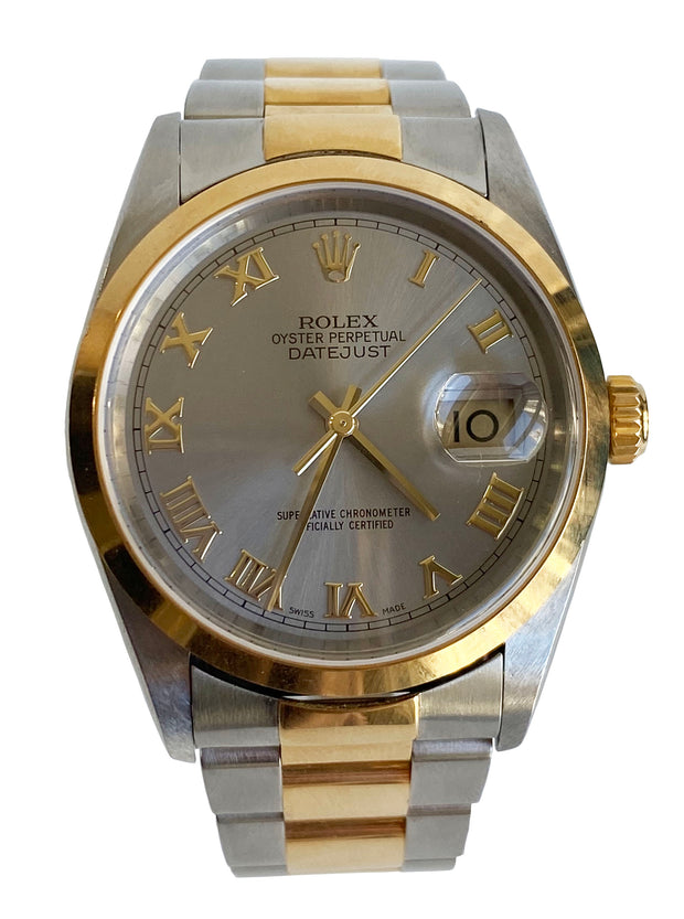 A close up of the Rolex Datejust Two Tone, with silvered dial and gold Roman numerals.
